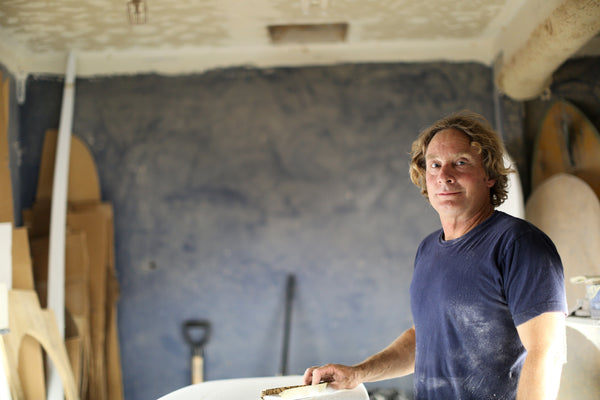 Jon Wegener shaping a surfboard in his shaping room